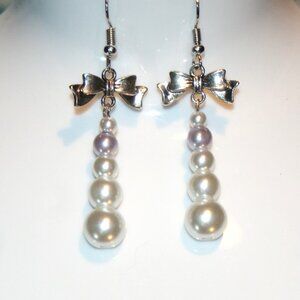White faux pearl dangle earrings with bow detail ED-10-004